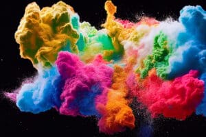 Multicolor splash of particles. Festival of colours. Powder burst isolated on back background. Paint